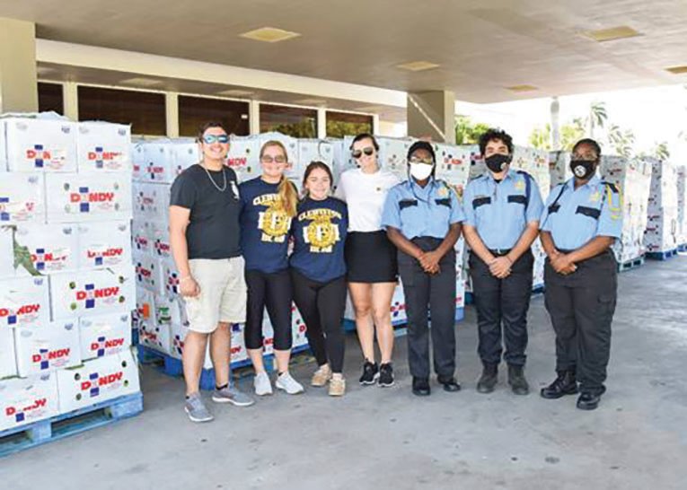 Representatives from the Clewiston High School FFA and members of the Clewiston High School Public Service Academy assisted with distribution at the John Boy Auditiorium.